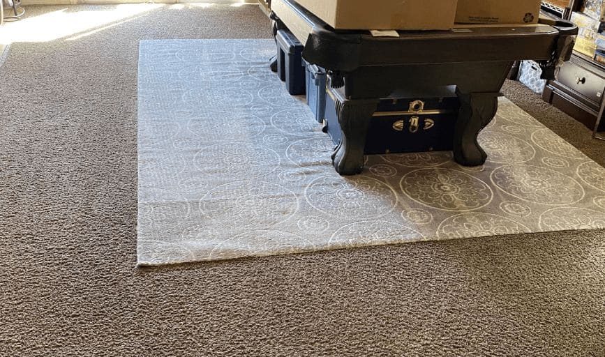 Area rug cleaned in a game room