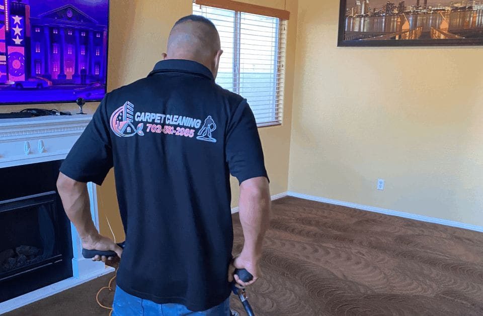 K&A Carpet Cleaning technician cleaning a living room carpet